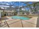 Aerial view of a screened-in pool area with an expansive deck and lush landscaping at 105 Valley Ct, Longwood, FL 32779