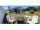 Spacious backyard featuring a pool and an outdoor fire pit area with seating at 10879 Norcross Cir, Orlando, FL 32825
