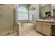 Elegant bathroom featuring a large soaking tub, separate shower, and a vanity at 10879 Norcross Cir, Orlando, FL 32825