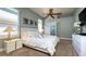 Bright bedroom featuring a ceiling fan, ensuite and lots of natural light at 10879 Norcross Cir, Orlando, FL 32825
