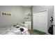 Cozy bedroom with a bed, dresser, and decor at 10879 Norcross Cir, Orlando, FL 32825