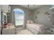 Pretty bedroom with a bed, a desk, and decor at 10879 Norcross Cir, Orlando, FL 32825