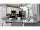 Modern kitchen with granite countertops and stainless steel appliances at 10879 Norcross Cir, Orlando, FL 32825