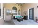 Cozy covered patio featuring comfortable seating, stylish decor, and a peaceful ambiance for relaxation at 10879 Norcross Cir, Orlando, FL 32825