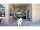 Spacious covered patio with ceiling fan, comfortable seating, and ample natural light for relaxing and entertaining at 10879 Norcross Cir, Orlando, FL 32825