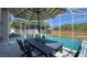Screened-in pool with outdoor seating and dining area, perfect for entertaining at 10879 Norcross Cir, Orlando, FL 32825