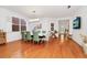 Bright dining room featuring hardwood floors, stylish chairs and a contemporary light fixture at 11718 Fitzgerald Butler Rd, Orlando, FL 32836