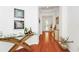 Inviting hallway with stylish decor, hardwood floors, and a view of the front door at 11718 Fitzgerald Butler Rd, Orlando, FL 32836