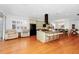 Open-concept kitchen featuring a large island with seating and views into a seating and dining area at 11718 Fitzgerald Butler Rd, Orlando, FL 32836