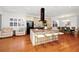 Bright kitchen with a central island and seating area, flowing into the dining and living spaces at 11718 Fitzgerald Butler Rd, Orlando, FL 32836