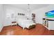 Bright and airy bedroom with hardwood floors, accent furnishings, and a modern chandelier at 11718 Fitzgerald Butler Rd, Orlando, FL 32836