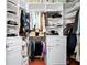 Spacious walk-in closet with custom shelving, drawers and ample storage for clothes and accessories at 11718 Fitzgerald Butler Rd, Orlando, FL 32836