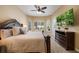 Comfortable bedroom with ceiling fan and large windows offering natural light and view at 128 Hallstrom Ct, Debary, FL 32713