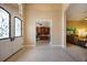 Spacious foyer with decorative glass double doors and views into the office and living room at 128 Hallstrom Ct, Debary, FL 32713
