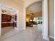 Open foyer transitions to the office and living room, showcasing the home's elegant floor plan at 128 Hallstrom Ct, Debary, FL 32713