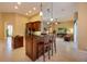 Spacious kitchen with an island and stainless steel appliances, open to the living area at 128 Hallstrom Ct, Debary, FL 32713