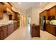 Modern kitchen with custom wood cabinets, granite countertops, and stainless steel appliances at 128 Hallstrom Ct, Debary, FL 32713