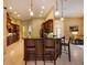 Spacious kitchen with an island, pendant lighting, and stainless steel appliances, open to the living area at 128 Hallstrom Ct, Debary, FL 32713