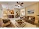 Spacious living room with bar seating and an open floor plan, perfect for entertaining guests at 128 Hallstrom Ct, Debary, FL 32713