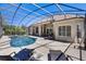 Screened-in pool with lounge chairs offers a great place to relax and enjoy the Florida sunshine at 128 Hallstrom Ct, Debary, FL 32713