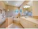 This elegant bathroom features double sinks, a separate tub, a shower stall, and neutral walls at 128 Hallstrom Ct, Debary, FL 32713