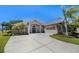 Stunning home featuring a paved driveway and manicured landscaping, exuding curb appeal at 128 Hallstrom Ct, Debary, FL 32713