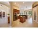 Spacious kitchen with island, stainless appliances, and granite countertops, great for entertaining and cooking at 128 Hallstrom Ct, Debary, FL 32713