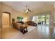 Spacious living room featuring tile flooring and sliding glass doors to the outdoor living space at 128 Hallstrom Ct, Debary, FL 32713
