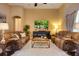 Cozy living room with comfortable seating, a white shag rug, and an entertainment center at 128 Hallstrom Ct, Debary, FL 32713