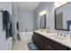 Bathroom featuring double vanity, a freestanding tub, and a walk-in shower at 129 S Park Ave # 129, Winter Garden, FL 34787
