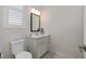 Bright bathroom features white vanity with carrara marble countertop at 129 S Park Ave # 129, Winter Garden, FL 34787