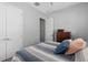 Cozy bedroom featuring a bed with striped bedding at 129 S Park Ave # 129, Winter Garden, FL 34787