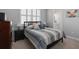 Neutral-toned bedroom with a comfy bed, side tables and an ensuite bathroom at 129 S Park Ave # 129, Winter Garden, FL 34787