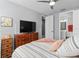 Serene bedroom featuring a cozy bed and a view of the bathroom, offering a private retreat within the home at 129 S Park Ave # 129, Winter Garden, FL 34787