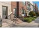 Brick townhome featuring a covered entry, multi-pane windows, and professional landscaping at 129 S Park Ave # 129, Winter Garden, FL 34787