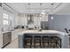 Modern kitchen featuring a spacious center island, stainless steel appliances, and stylish pendant lighting at 129 S Park Ave # 129, Winter Garden, FL 34787