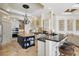 Open kitchen design with island, stainless appliances, and breakfast bar at 13025 Water Point Blvd, Windermere, FL 34786
