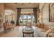 Sophisticated living room with luxury decor, chandelier, and waterfront view at 13025 Water Point Blvd, Windermere, FL 34786