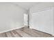 Neutral bedroom with wood-look floors and a double door closet at 13971 Sw 46Th Ter, Ocala, FL 34473