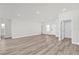 Expansive living area with light-colored floors, featuring a large doorway and plenty of natural light at 13971 Sw 46Th Ter, Ocala, FL 34473
