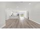 Bright open-concept living room and kitchen area with recessed lighting and modern flooring at 13971 Sw 46Th Ter, Ocala, FL 34473