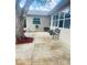 Cozy backyard retreat offers a spacious patio area with mature shade tree and lush landscaping at 1414 Meadowlark St, Longwood, FL 32750