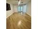 Spacious, open bedroom features a ceiling fan, hardwood floors, and lots of natural light at 1414 Meadowlark St, Longwood, FL 32750