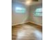 This room boasts hardwood floors, a ceiling fan and two windows for great natural light at 1414 Meadowlark St, Longwood, FL 32750