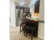Open concept kitchen with bar seating, stainless steel appliances, and modern finishes at 1414 Meadowlark St, Longwood, FL 32750
