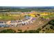 Gorgeous aerial view of the community showcasing the golf course and beautiful homes at 16018 Volterra Pt, Bella Collina, FL 34756