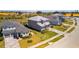 Aerial view of the residence exhibiting lush landscaping and elegant brick driveway at 16018 Volterra Pt, Bella Collina, FL 34756