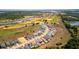 Wonderful aerial view of a golf community with pristine fairways and manicured lawns at 16018 Volterra Pt, Bella Collina, FL 34756