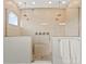 Bathroom featuring a shower with glass doors, rainfall shower heads, body jets, and a built-in bench at 16018 Volterra Pt, Bella Collina, FL 34756
