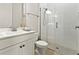 Modern bathroom with a glass-enclosed shower, neutral tones, and bright lighting at 16018 Volterra Pt, Bella Collina, FL 34756